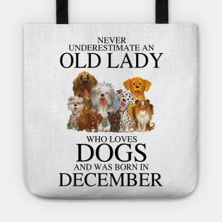 Never Underestimate An Old Lady Who Loves Dogs And Was Born In December Tote