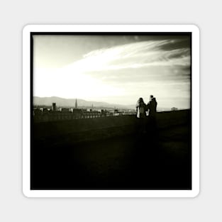 A couple take in the view near Edinburgh Castle Magnet