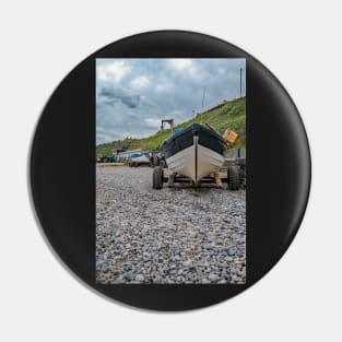 Front end view of fishing boat on the beach Pin