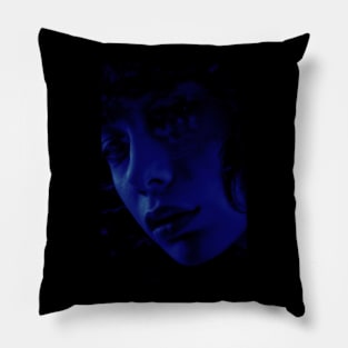 Beautiful girl face in dark blue lighting. Beautiful light tones defines shapes. Pillow