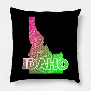 Colorful mandala art map of Idaho with text in pink and green Pillow