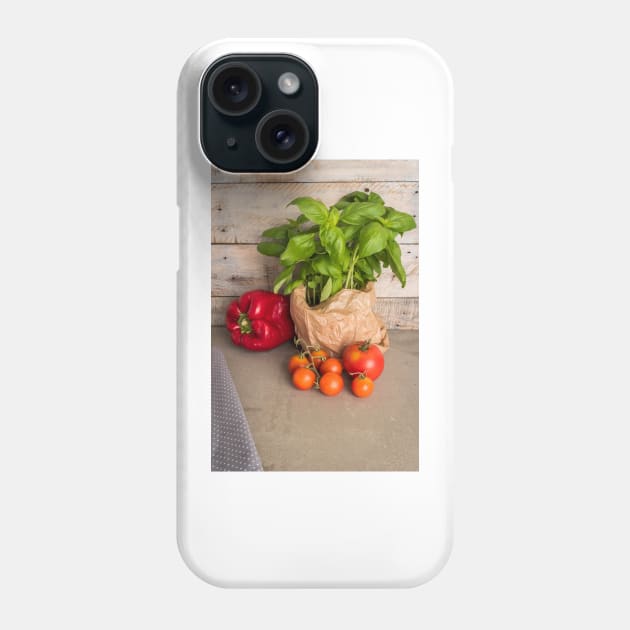 Fresh basil and other ingredients for Italian cuisine. Cherry tomatoes, basil and red pepper Phone Case by AnaMOMarques