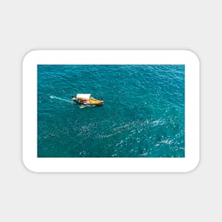 Top view on fishing boat in turquoise Mediterranean sea Magnet