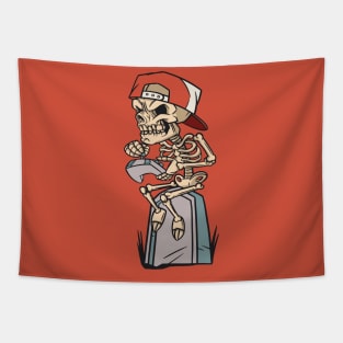 Cartoon Skeleton Gamer Sitting on a Tombstone Tapestry