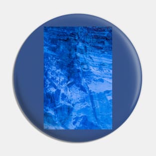 Blue abstract surface from a scratched stonewall Pin