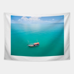 Aerial view of fishing boat on emerald sea Tapestry