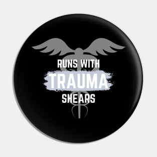 Runs with trauma shears blue and white text with caduceus design Pin