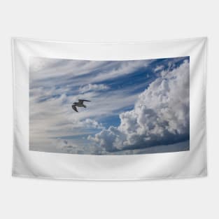 White seagull flying in bright blue sky Tapestry