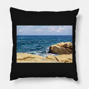 Wave and splashes on rocky Malta beach Pillow