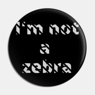 I'm not a zebra. White letters with a mask in the shape of diagonal stripes Pin