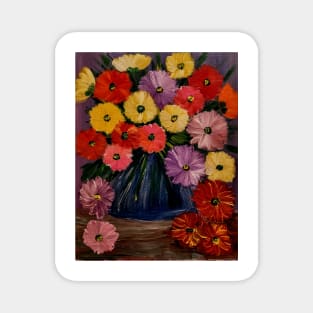 A  lovely boutique of abstract mixed flowers  in a blue vase . Magnet