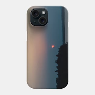 Sunset through a smoky sky Phone Case