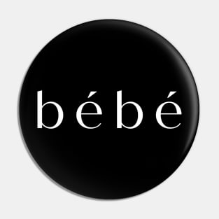 bebe in white on black shirt Pin