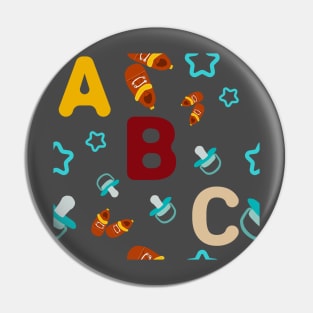 abc pattern with rounded star, pacifer and baby's shoes Pin