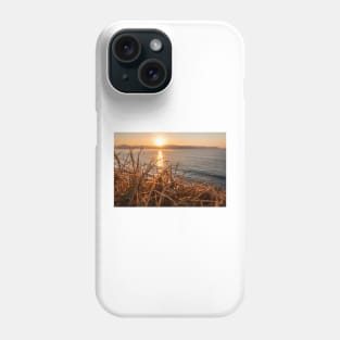 Sunrise from behind the grass on the mountain at umina on nsw central coast Phone Case