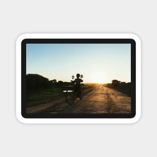 Silhouette of Boy Riding Bicycle at Sunset in Burmese Countryside Magnet