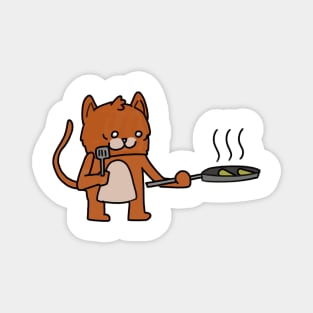 a cat cooking some food Magnet