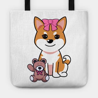 Funny orange dog is holding a teddy bear Tote