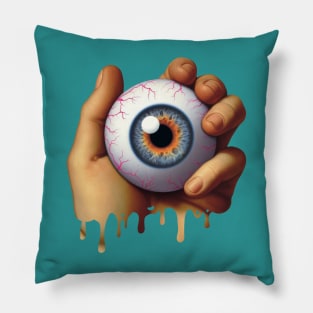 Hand holding an Eyeball Pillow