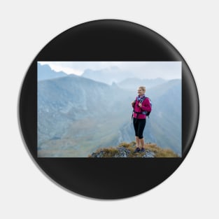 Woman backpacker hiking on a trail Pin