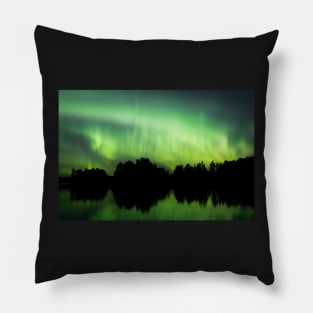 Northern lights glowing over lake in Finland Pillow