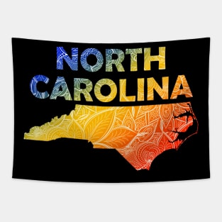 Colorful mandala art map of North Carolina with text in blue, yellow, and red Tapestry