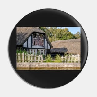 Traditional riverside cottage with thatched roof Pin