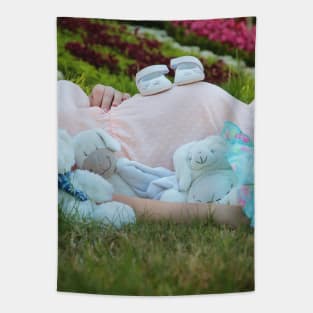 pregnant woman in the park surrounded by stuffed toys Tapestry