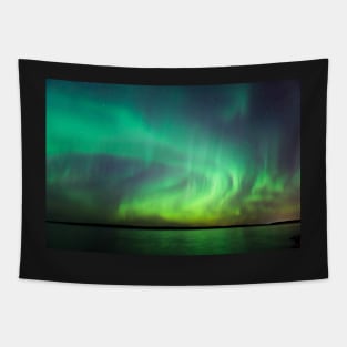 Northern lights over lake in Finland Tapestry