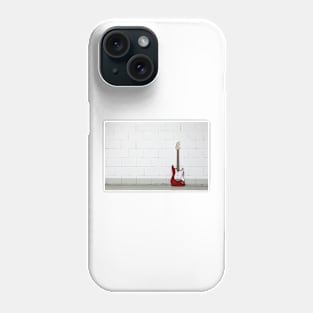 Red electric guitar against white brick wall Phone Case