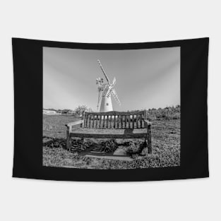 Wooden bench and traditional windmill on the riverbank Tapestry