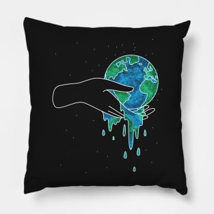 Hand holding melting earth Pillow