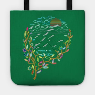 Beautiful view of the mountains from behind the trees Tote