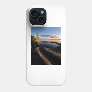 Natural rock pool in lakeshore at dawn Phone Case