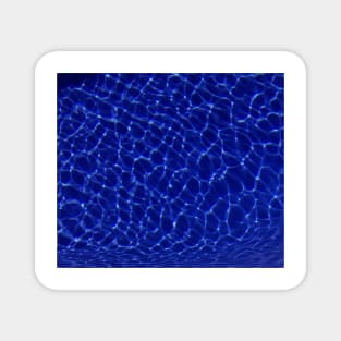 light reflections in blue water Magnet