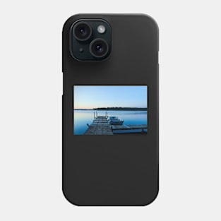 Wooden dock and a boat on blue clear water Phone Case