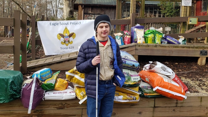 Mason poses with the supplies he gathered for his Eagle Scout project at Autrey Mill Nature Preserve.