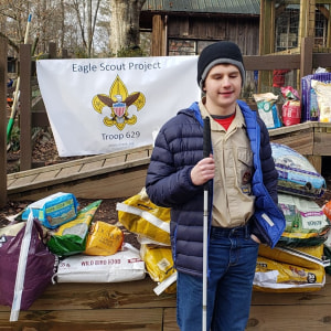 Mason poses with the supplies he gathered for his Eagle Scout project at Autrey Mill Nature Preserve.