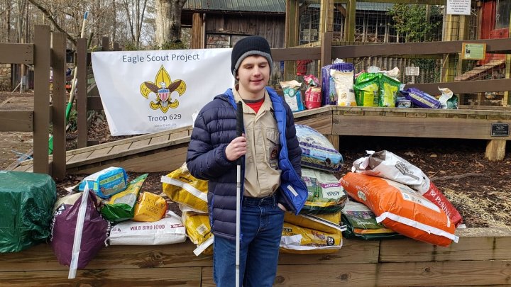 Mason poses with the supplies he gathered for his Eagle Scout project at Autrey Mill Nature Preserve.