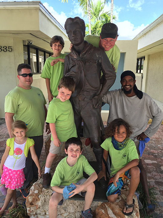 Pack 176 polished the Lone Scout in front of the Gulf Stream Council.