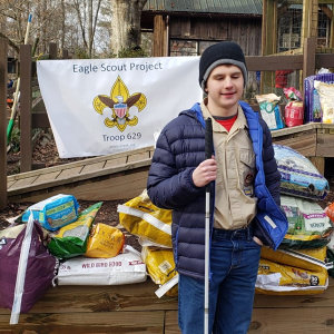 Mason poses with the supplies he gathered for his Eagle Scout project at Autrey Mill Nature Preserve.