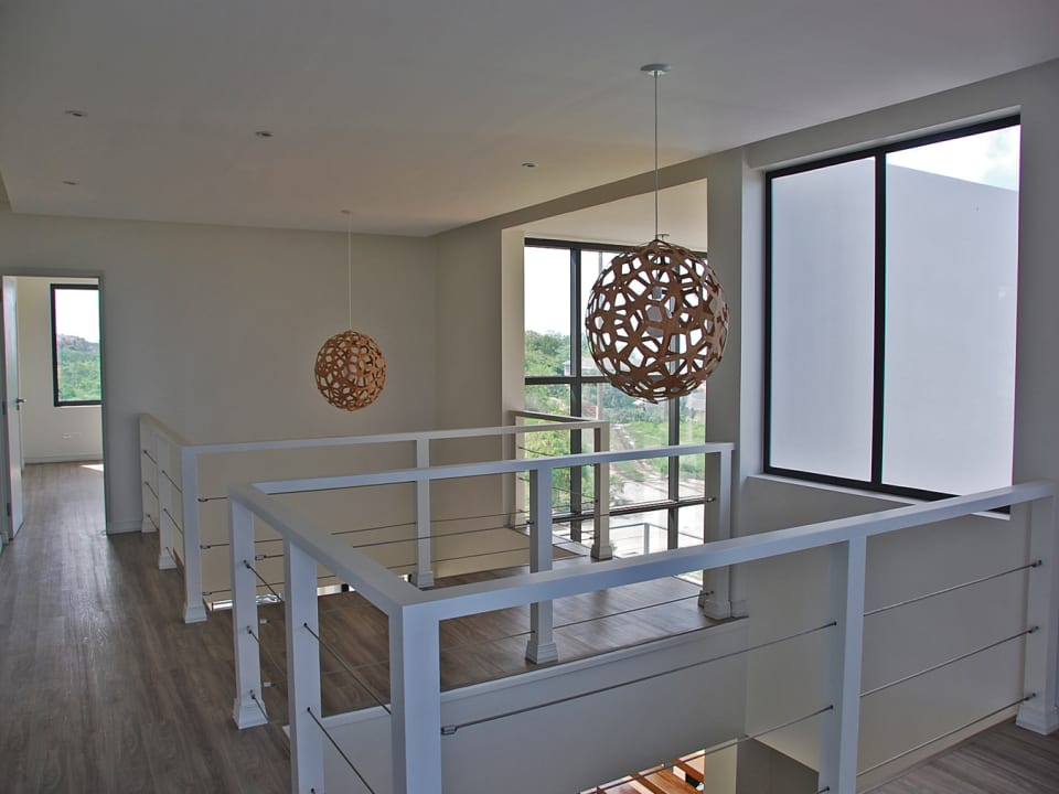 Upstairs landing area with playful light fixtures