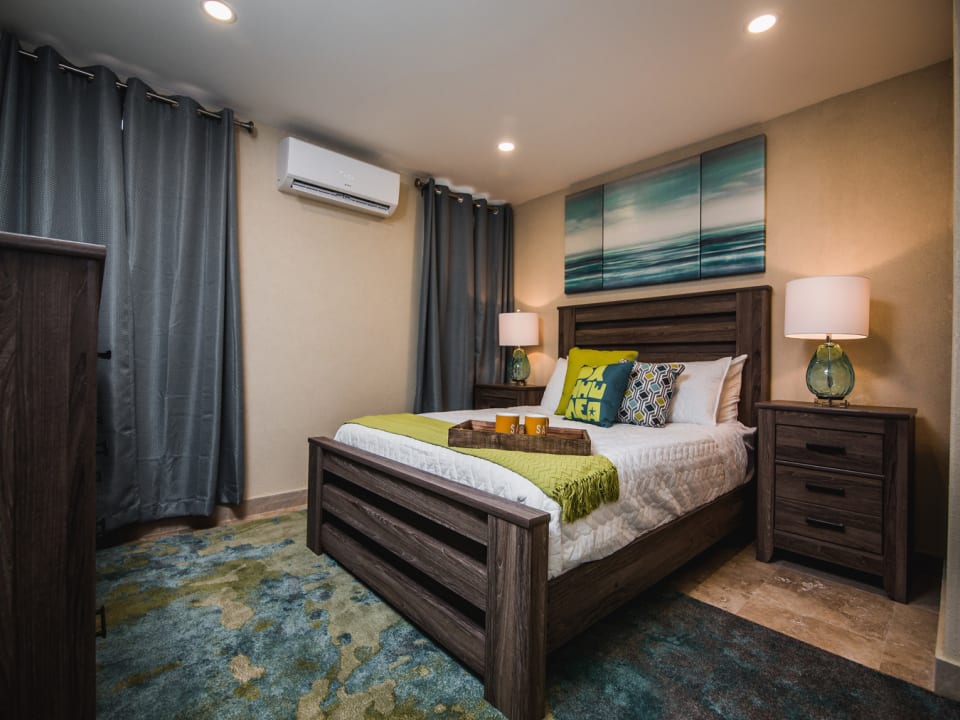 Air-conditioned bedroom with queen bed