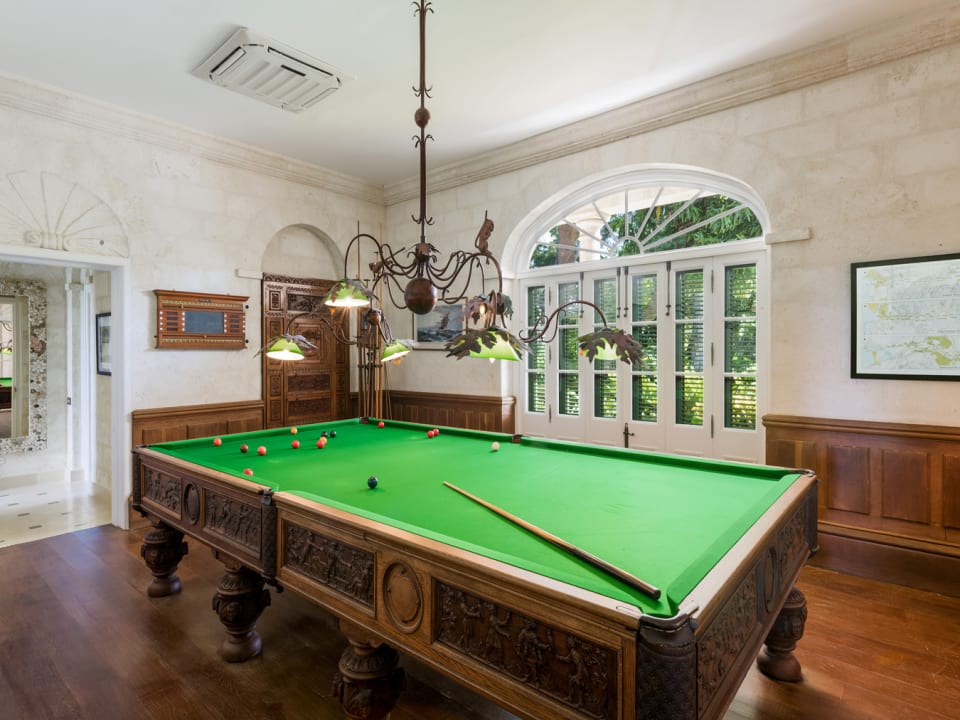 A billiards room invites  friendly rivalry