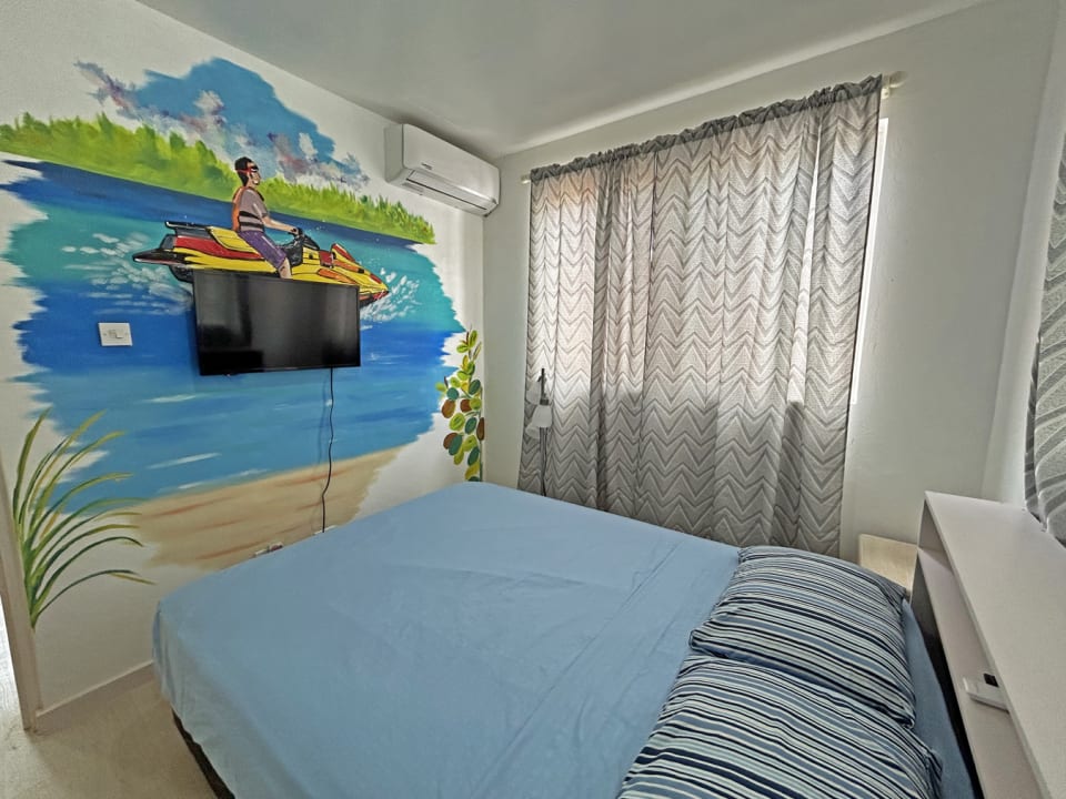 Bedroom with beach scene mural