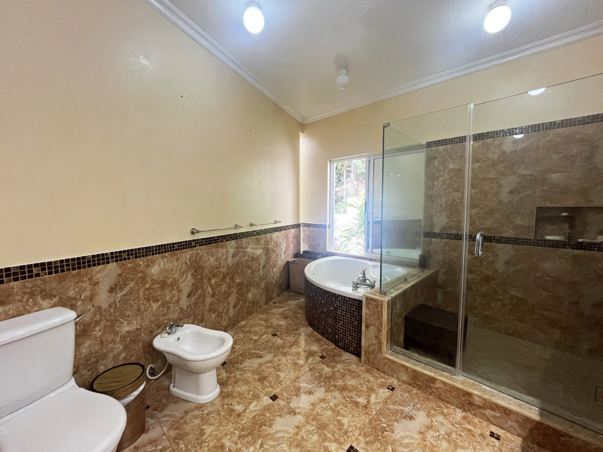 Lower primary bathroom with bathtub