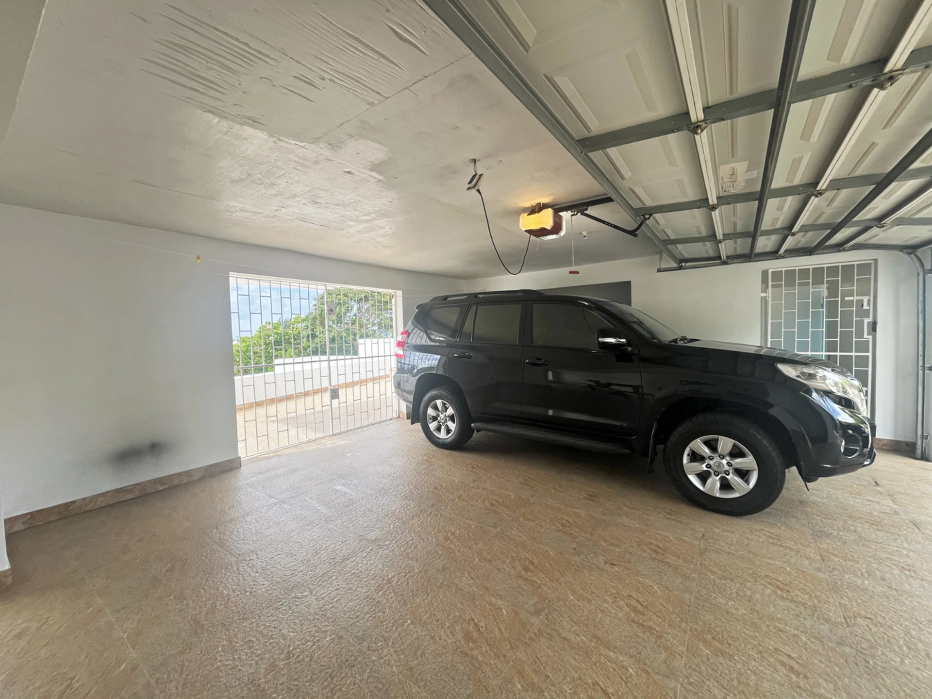 Secure, enclosed garage fits two vehicles