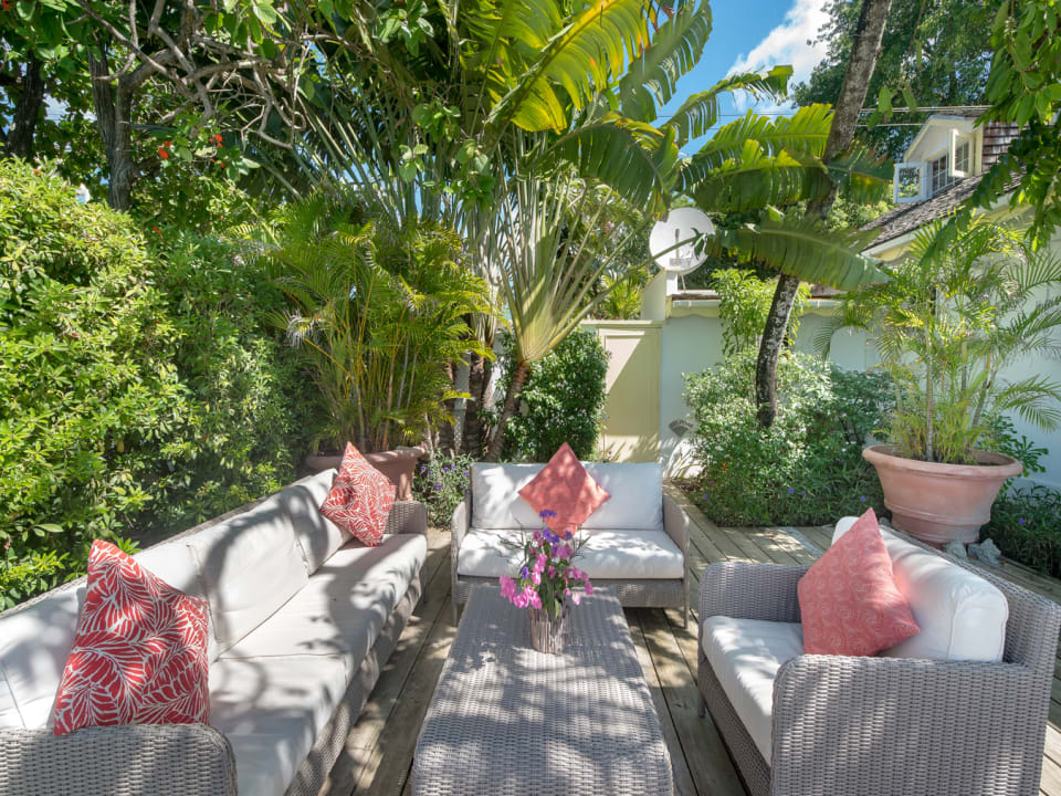 Al fresco sitting area in courtyard overlooks the sea