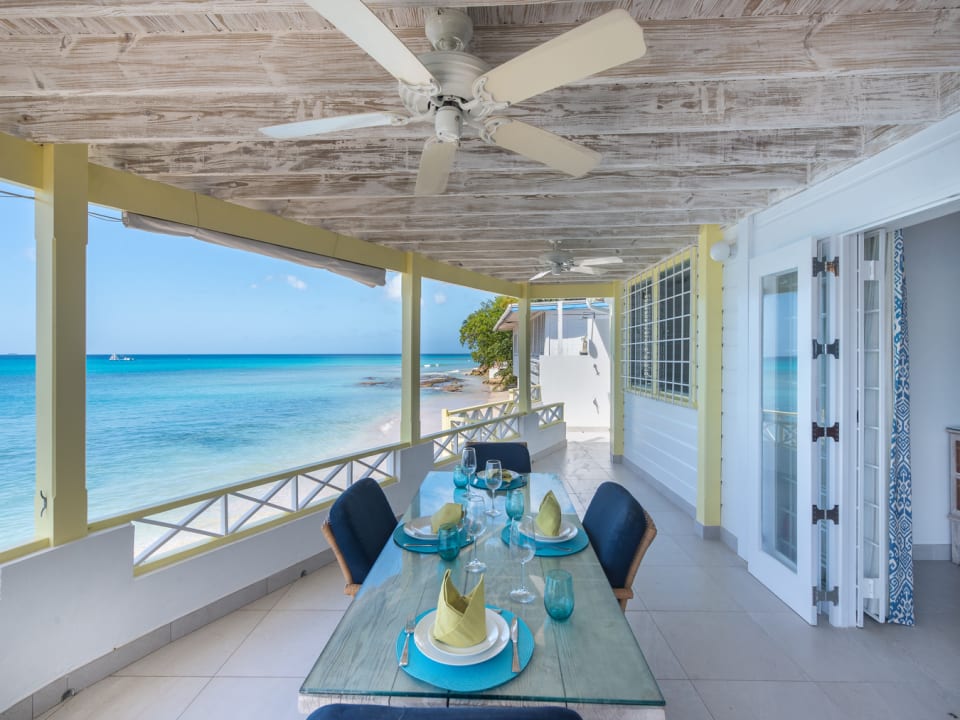 Dining terrace and stairs to sandy cove