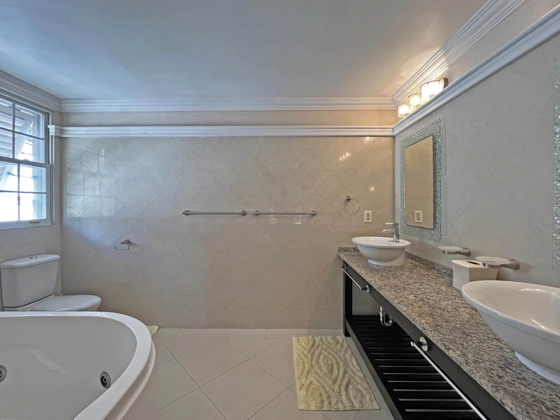 En-suite primary bathroom with tub